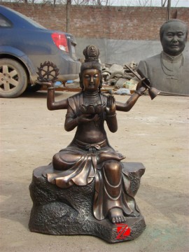 bronze outdoor kwan-yin sculpture with four arms