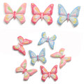 Venta caliente 100 unids / lote resina de mariposa cabujón de espalda plana Kawaii adorno de mariposa para Scrapbooking lazos para el cabello artesanía