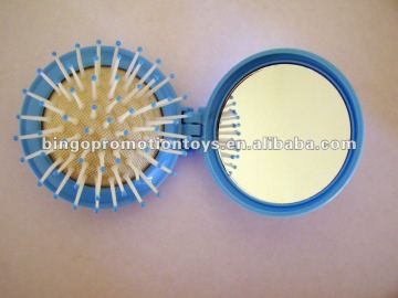 small cute circle mirror with comb