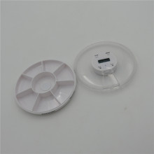 small round pill case with alarm