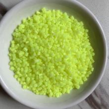 Granular fluorescent brightener plastic particle