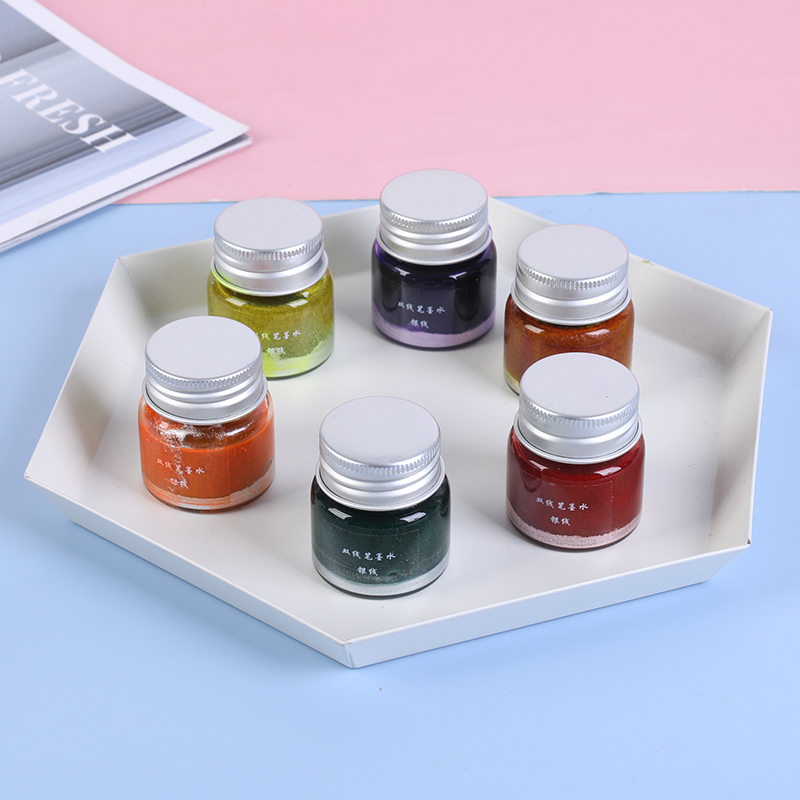 Encre fluorescente laminée à base d'eau