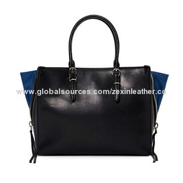 Handbags,features a top handle, exposed silver zipper with fringe at side, adjustable shoulder strapNew