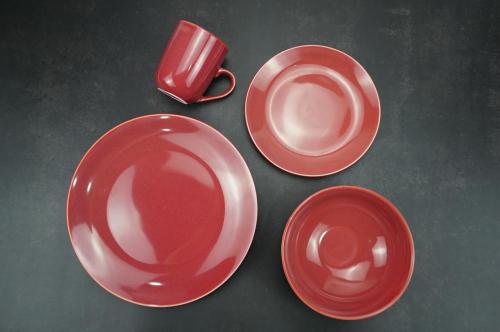 Reactive glazed stoneware dinner set in Claret-red