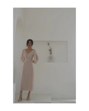 A creased beige dress in autumn style