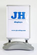 Street sidewalk display pavement sign with water tank