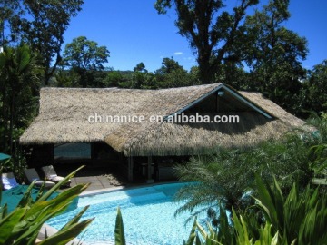 Serenity garden and backyard dining set with custom palapa structure rain cape thatch panels