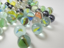 Three flower glass marbles for children playing