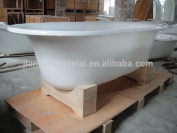 small freestanding bath with wooden cradles