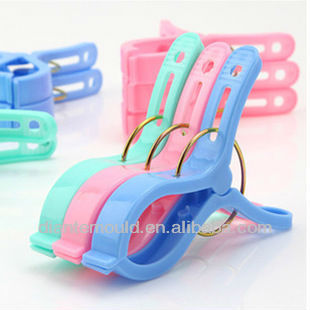 Plastic clothes clip retaining clips