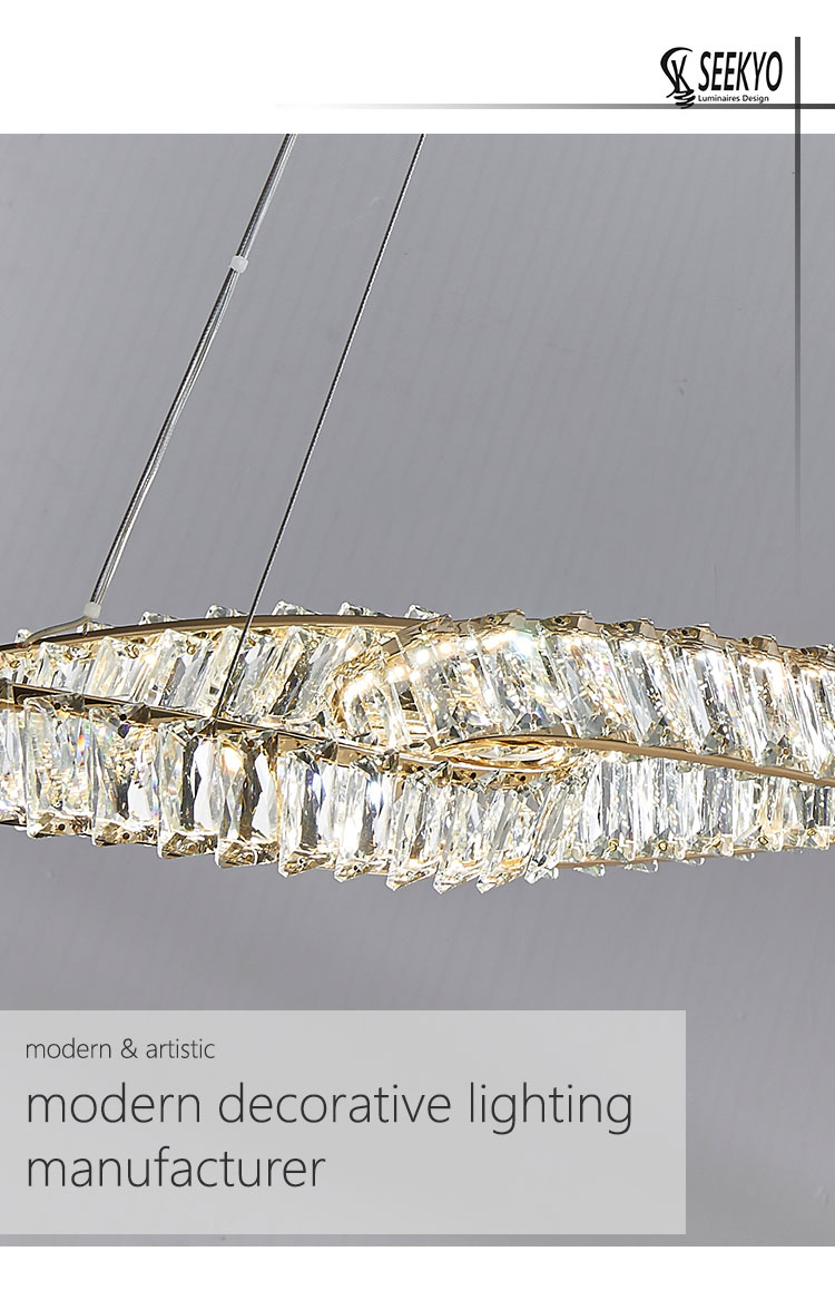 The chandeliers feature a unique design of three interlocking rings, which are suspended from a chain. The chandeliers feature a unique design of three interlocking rings, which are suspended from a chain.