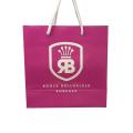 Logotipo de lujo Bolsa de papel de regalo rosa brillante personalizada