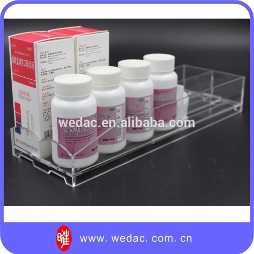 Healthcare products drugstore vitamin bottles display tray