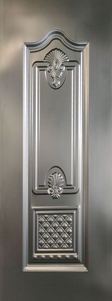 Decorative embossed steel door panel