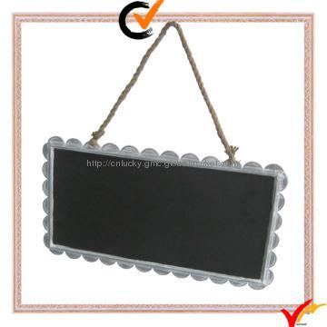 Wall haning metal blackboard in garden