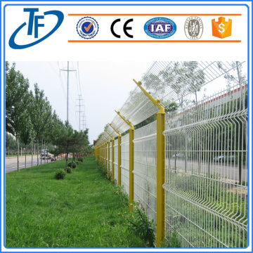 Colorful welded garden fence with peach shaped post