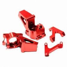 CNC machined steering nuckle, made of billet aluminum 6061-T6, with red anodized finish