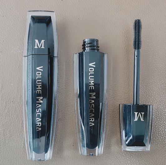 Plastic mascara bottle with brush