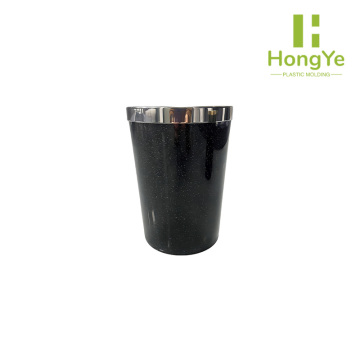 Compact black trash can with silver tip