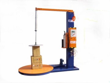 Top pressure pallet wrapping machine