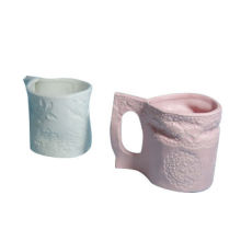 Ceramic mugs, decorated with lace pattern