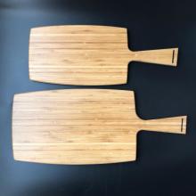 Large bamboo paddle cutting board with handle