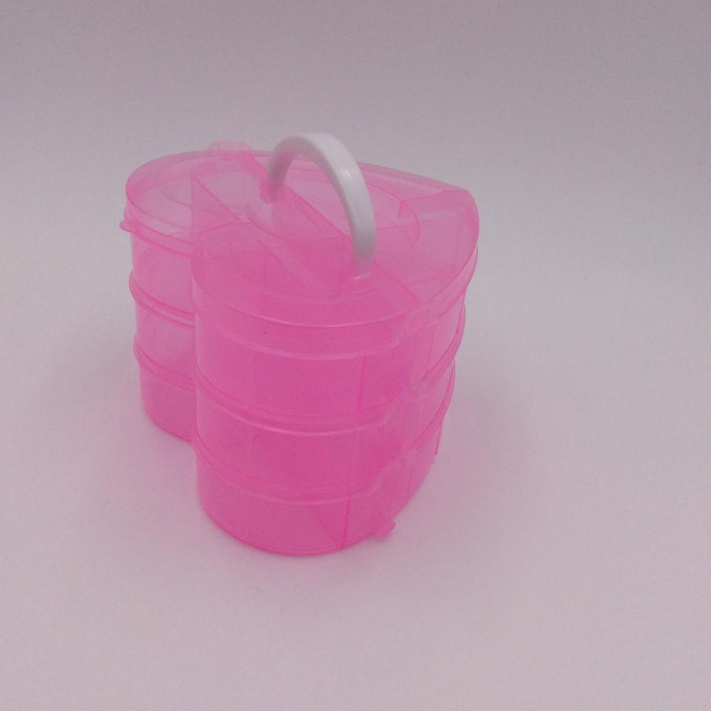 boîte de rangement en plastique rose en forme de cœur