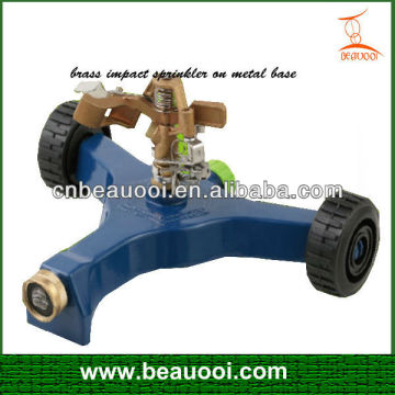 Brass impact sprinkler on metal impulse sprinkler