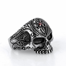 Polished electroplated skull ring with ruby