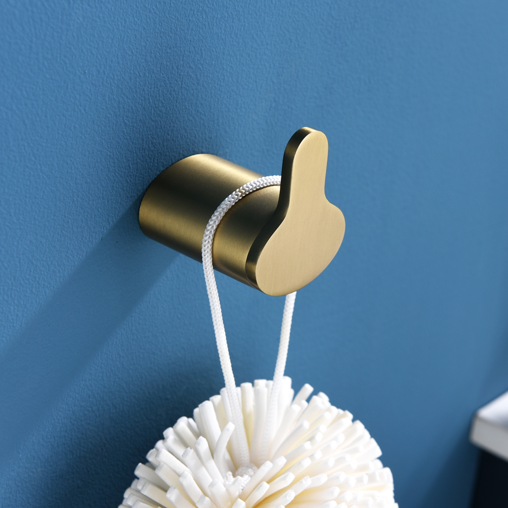 Durability and quality are the starting point for this design. Perfect for hanging up more than one towel. Make a statement with the Kaka robe hook. The collaboration of clean lines and confident form give this range a striking and contemporary look Purity of Form. The simple elegance of the hook will add a soft and elegant finishing highlight to enhance the bathroom's style. The hook pays tribute to the modern designs and quality of an earlier era with a fresh interpretation that will add timeless elegance to most bathroom. A practical robe hook with clean lines for increased utility in the bathroom. The Brushed brass finish robe hook has beautifully uncomplicated lines with round profiles to complement a range of bathroom styles.