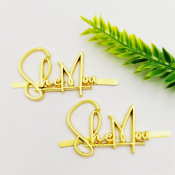 Golden Handbag with Metal Letters and Prong Backing