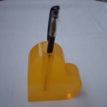 heart shaped office pen holder stand in table