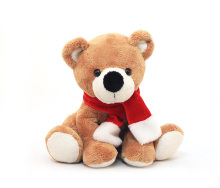 Plush bear with red Chrismas scarf
