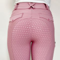 タイツのタイツに乗っているピンクの女性ポケットには馬術団のズボン