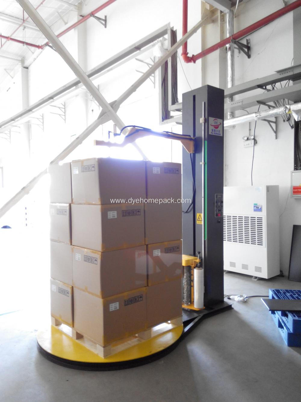 Pre-stretch pallet wrapper with top press