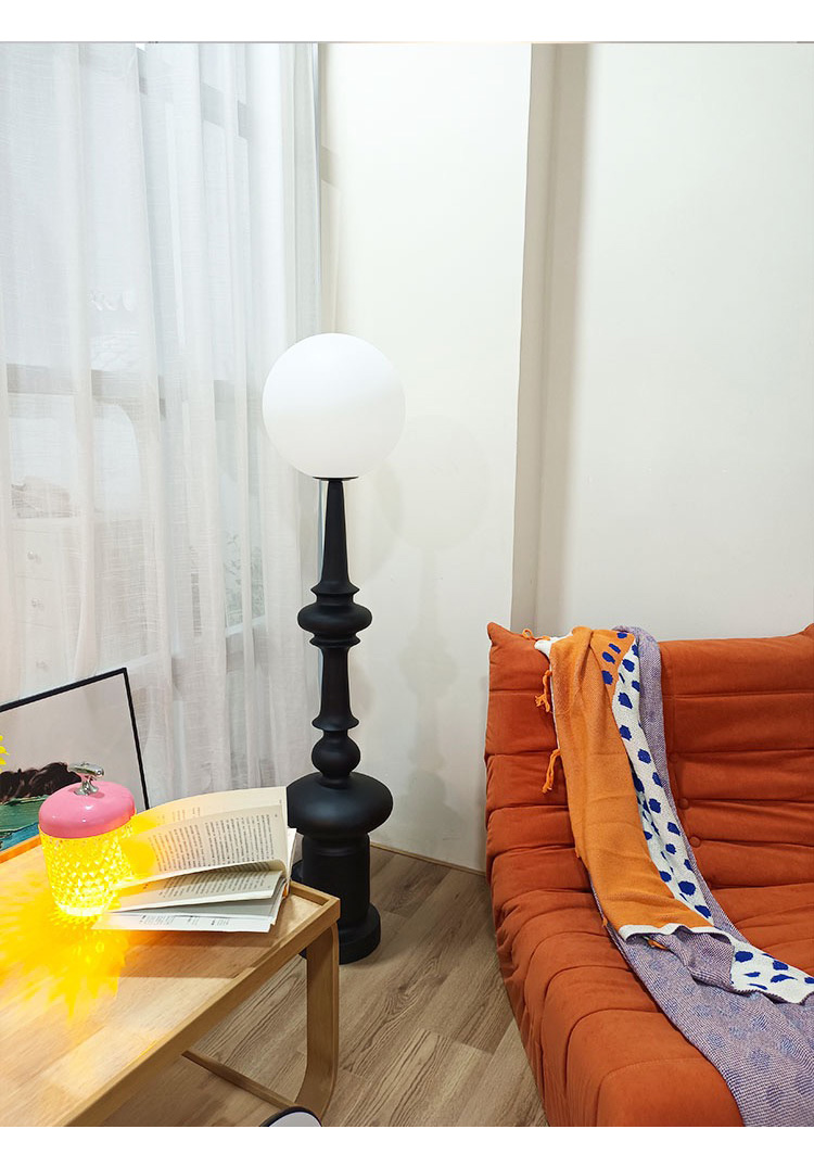 The lamp is made from black resin, which gives it a sleek and modern appearance while also showcasing the natural imperfections and textures of the material. The lamp is made from black resin, which gives it a sleek and modern appearance while also showcasing the natural imperfections and textures of the material.