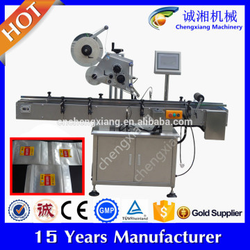 Automatic bag labeling machine