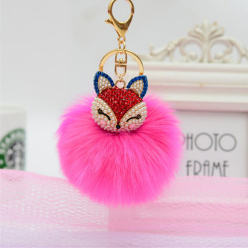 Genuine faux fox Fur Ball Pom Pom Keychain with A fashion Alloy Fox Head Studded with Synthetic Diamonds