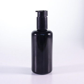 Botella de loción de vidrio negro de 100 ml con boquilla extendida