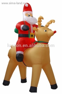 Inflated Santa Claus and his faithful deer