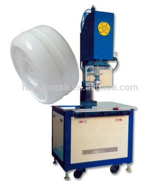 Plastic spin welding machine for round plastic parts
