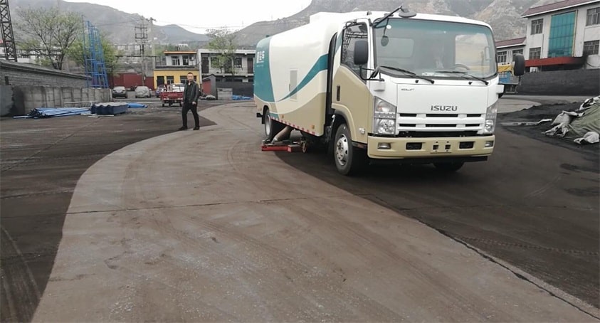 road sweep truck works in coal yard