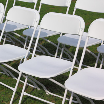 white stacking plastic folding chair