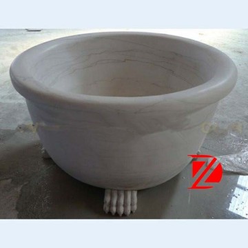 round stone bathtub with claw feet