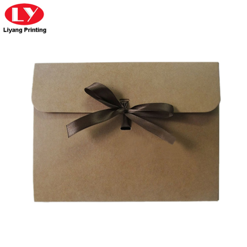 Kraft paper envelope with ribbon closure