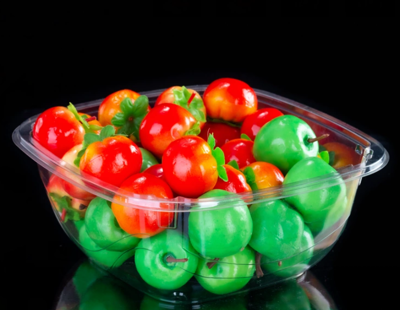 Caja de fruta de plástico con tapa abatible