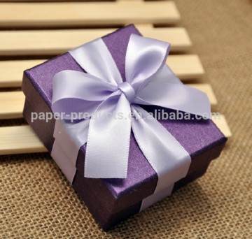 purple gift box with ribbon bow