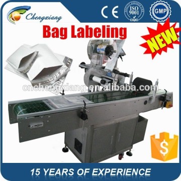 2015 hot automatic adhesive labeling machine for bag,labeling machine bag,plastic bag labeling machine