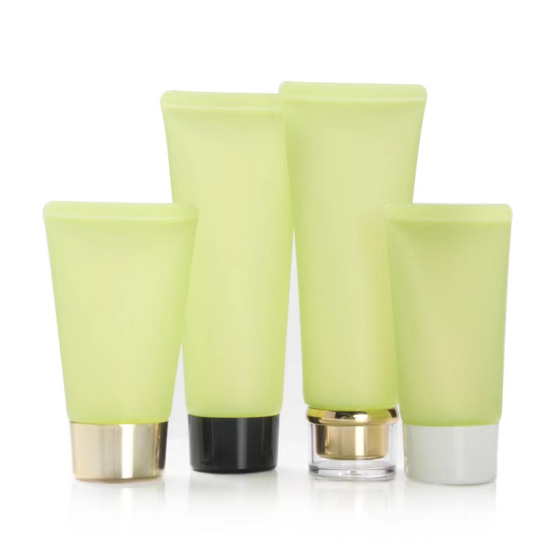 Vendita calda Crema solare cosmetica opaca con tubo in plastica verde glassata con coperchio acrilico a vite
