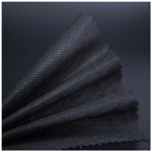 Low temperature fusing polyester paper interlining fabric